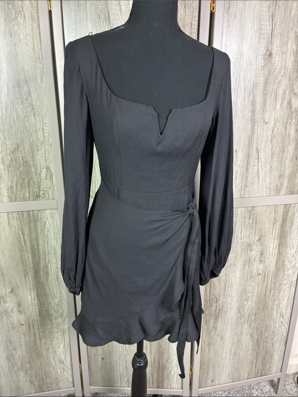 Hello Molly Black Long Sleeve Wrap Mini Dress with Ruffle Hem and V-Notch
